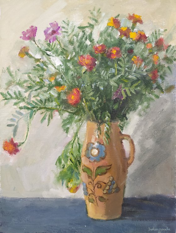 Marigolds in a ceramic pot