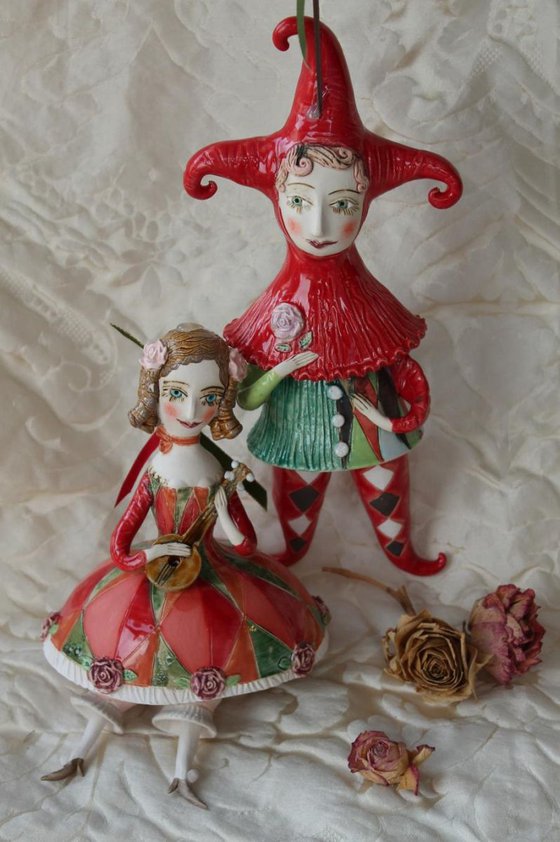 Girl with a mandolin. Sculptured bell-doll
