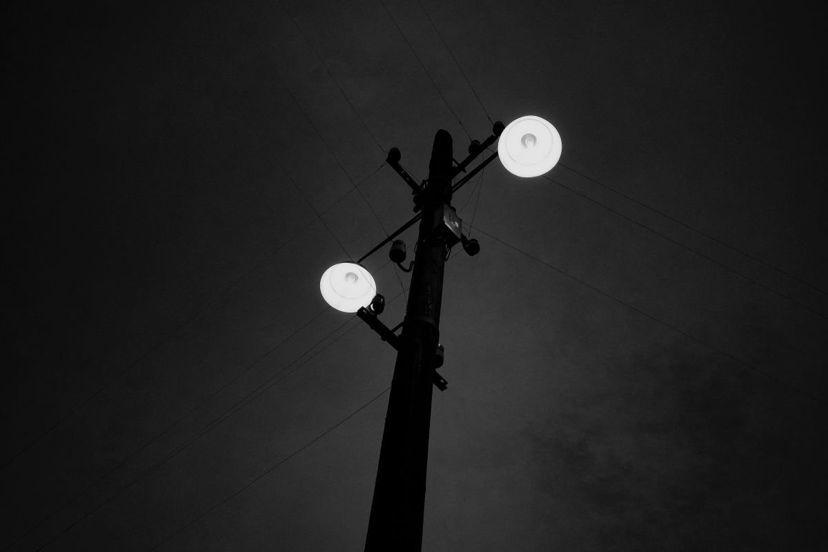two lightbulbs in the darkness by Christian Schwarz