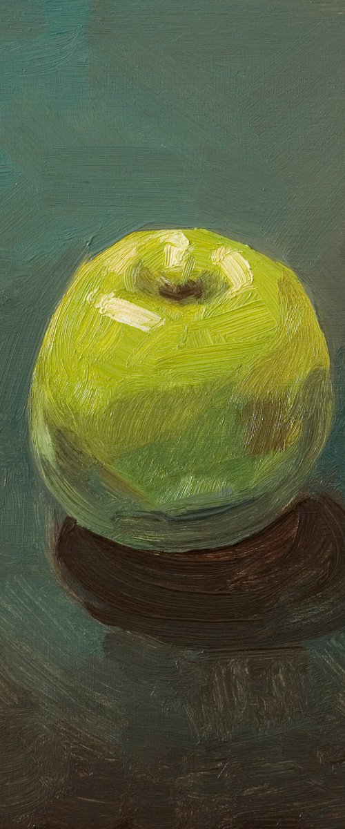 still life of fresh green apple on a blue background by Olivier Payeur