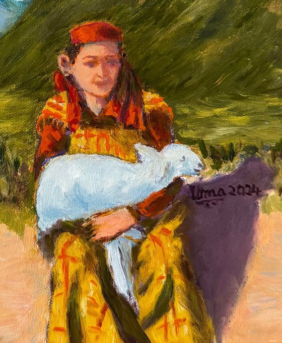 Woman holding her lamb