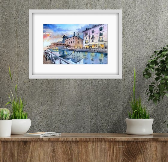 City landscape. Sunset and reflection of architecture in the water. Original watercolor artwork.
