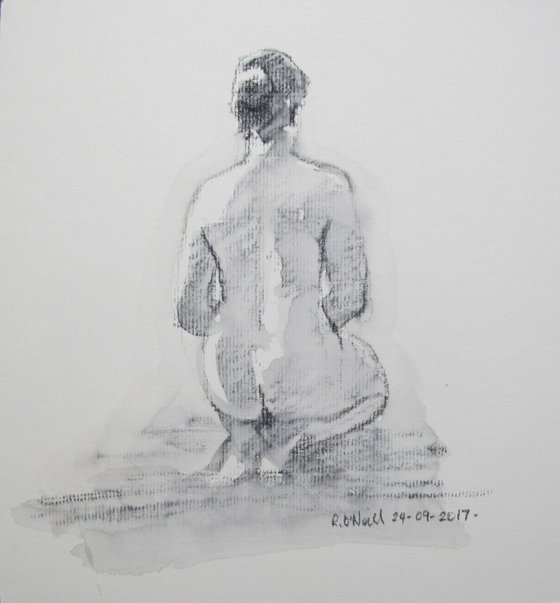 Seated female nude back view