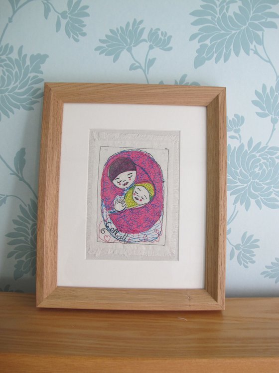 Mother and baby wrapped in a pink blanket.    Mixed media  Textile