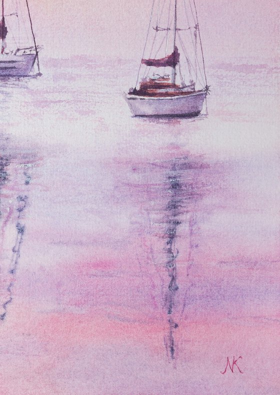 Sailboats on a pink sunset