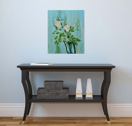 Yellow roses in a pot on blue