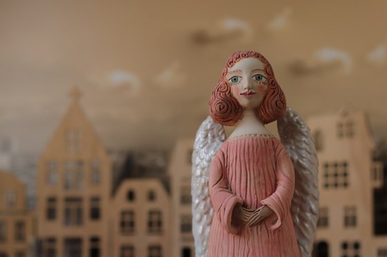 Angels all around me. Angel of hope. Ceramic sculpture