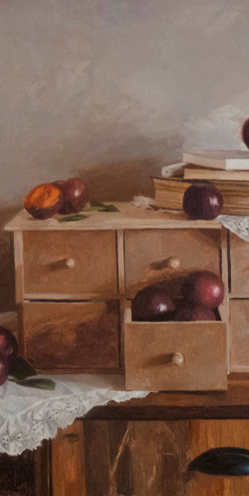 Plums, candle and books by Radosveta Zhelyazkova