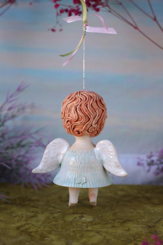 Tiny hanging sculpture. Angel