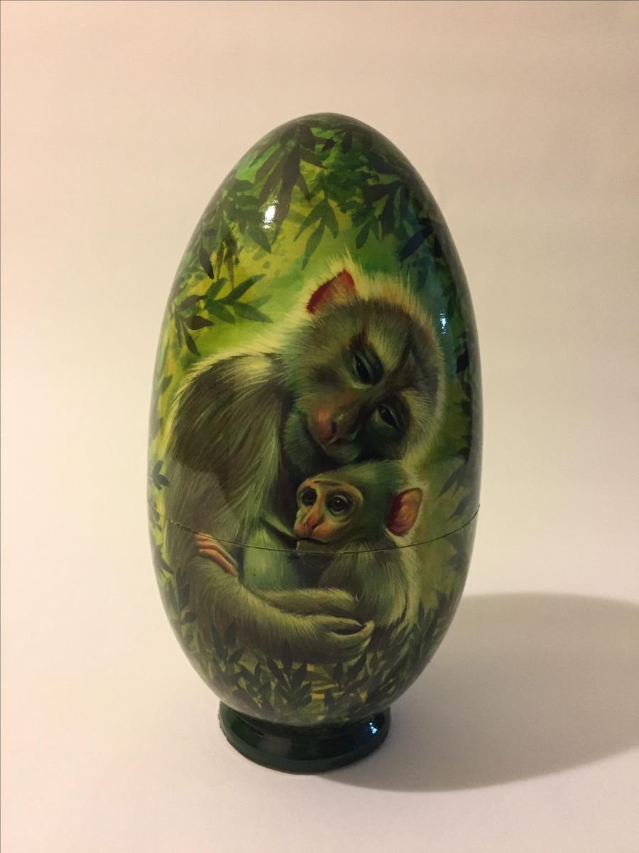 Monkey mother and her baby. Lacquered art painted on wooden egg (casket) by Liubov from LUMIAA