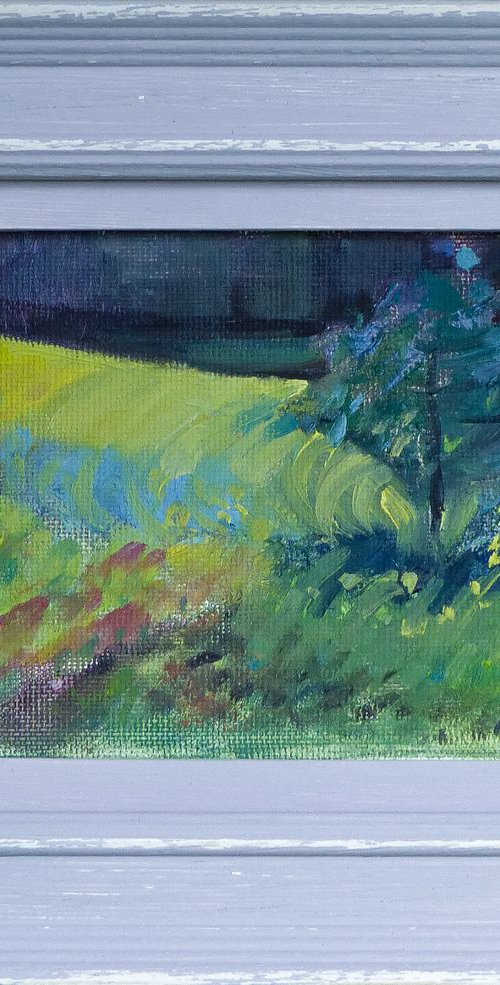Sunflower field with tree by Alexandra Morris