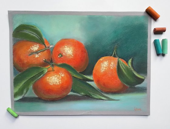 Golden-red tangerines on a turquoise background