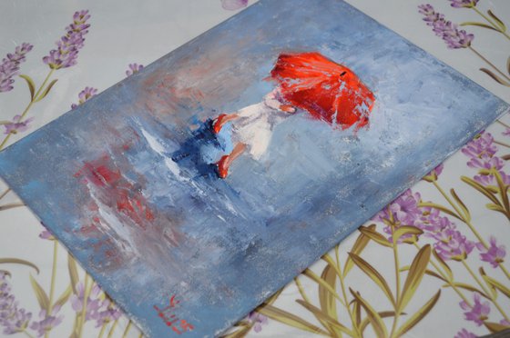 A girl running through puddles