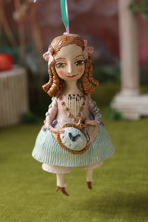Little Girl with a clock. Hanging sculpture, bell doll by Elya Yalonetski