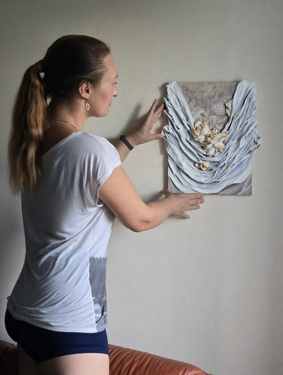 Floral and folds relief panel