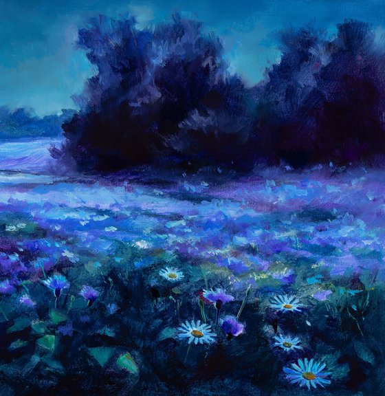 Blue cornflower field at night