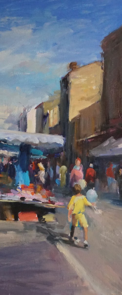 Market ,child with balloon by Manuel Leonardi