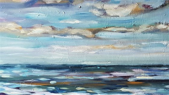 Clouds dance across the big blue sky towards the horizon - semi abstract seascape