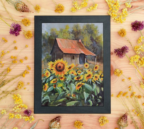 Old cabin with sunflower yard