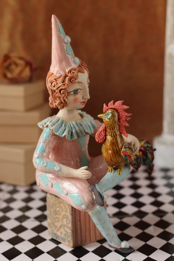 Sitting Pierrot in Blue with a Rooster