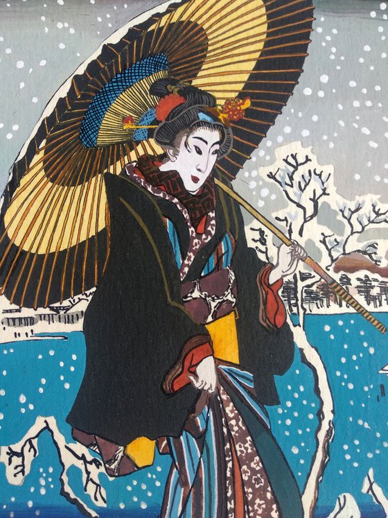 Young woman with umbrella and snow