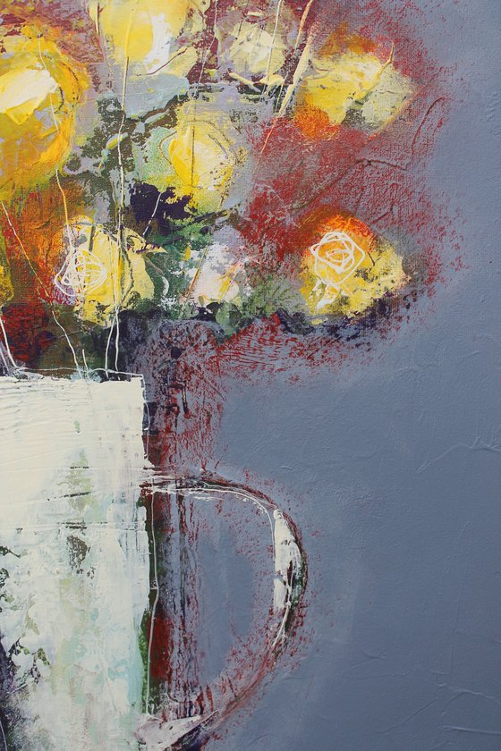 Flowers in a white jug.