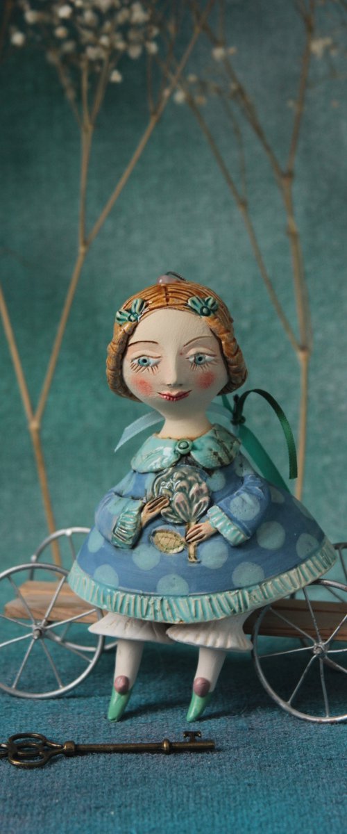 Little Girl in tender blue dress. Hanging sculpture, bell doll by Elya Yalonetski by Elya Yalonetski