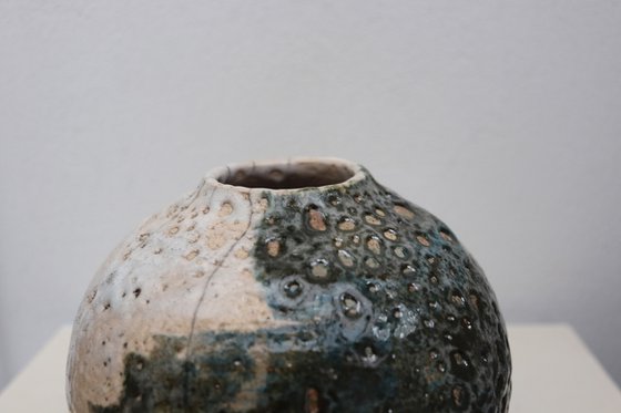 Raku and black smoked vessel.