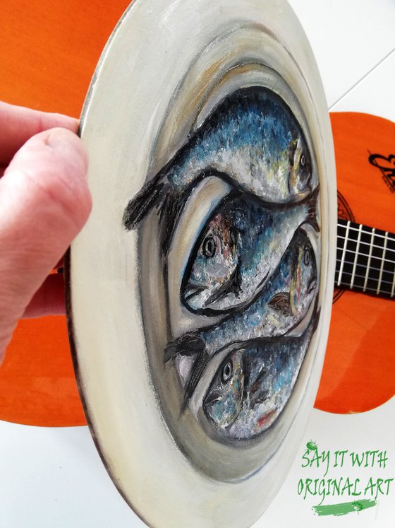 Four Fishes in a Plate