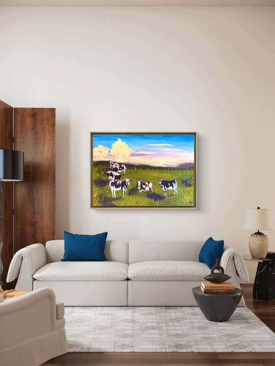 Cows grazing in the field