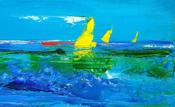 Yellow sailboats on the sea on a summer sunny day