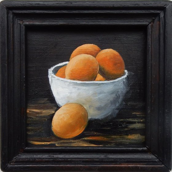 Eggs in a bowl. Small framed painting.