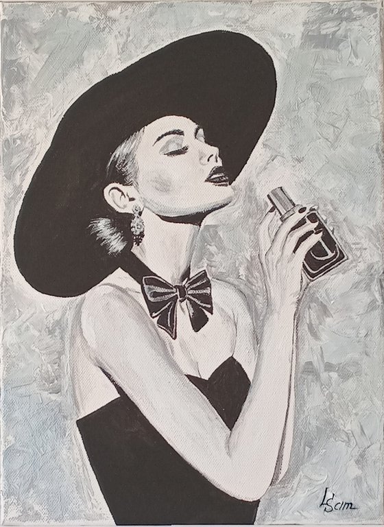 Woman with a bottle of perfume