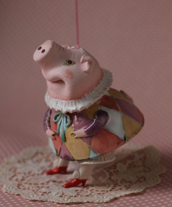 Little piggy in harlequin dress. Hanging sculpture, bell doll by Elya Yalonetski