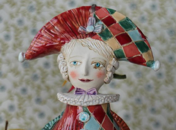 Harlequine. Sculptured bell-doll