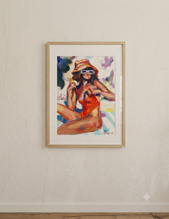 Girl in a red orange swimsuit and panama hat