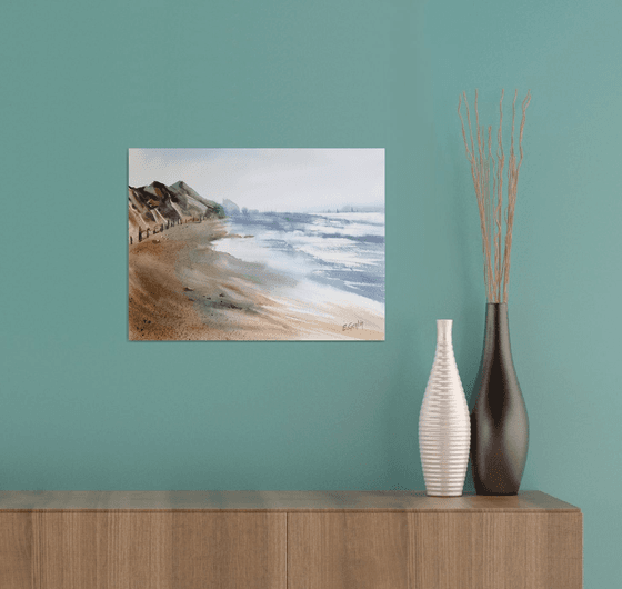 Seascape with beach and mountains