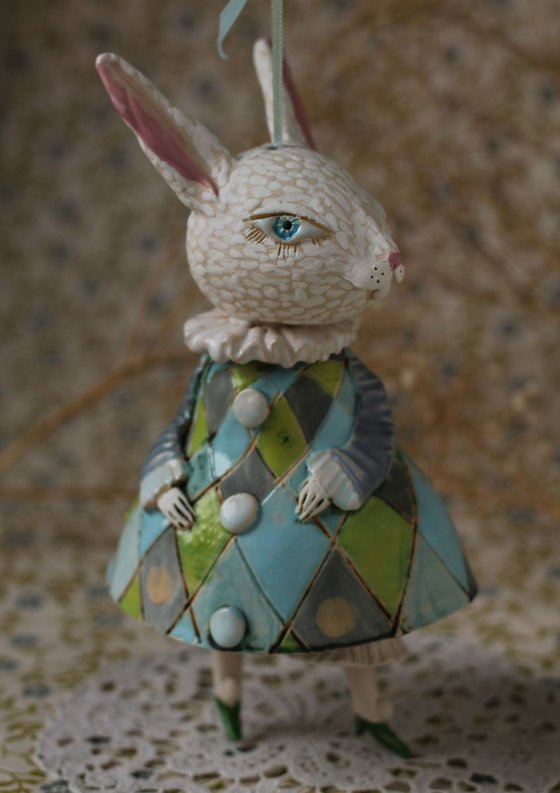 Little rabbit in harlequin dress. Hanging sculpture, bell doll by Elya Yalonetski