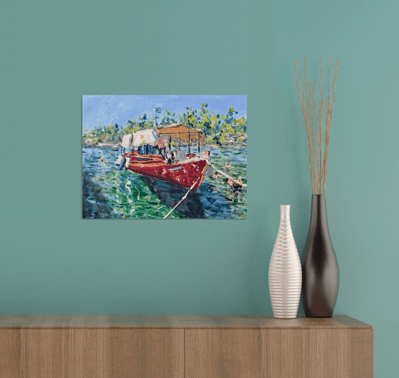 Red boat green waters