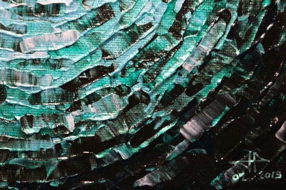 Small shine of iridescent emerald blue glow