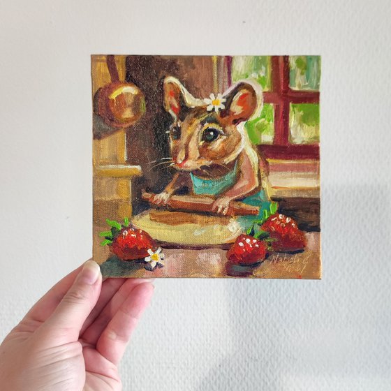 The mouse is baking a strawberry pie