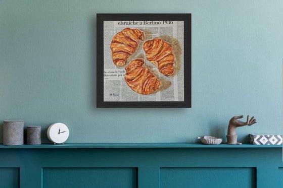 Three Croissants on Newspaper