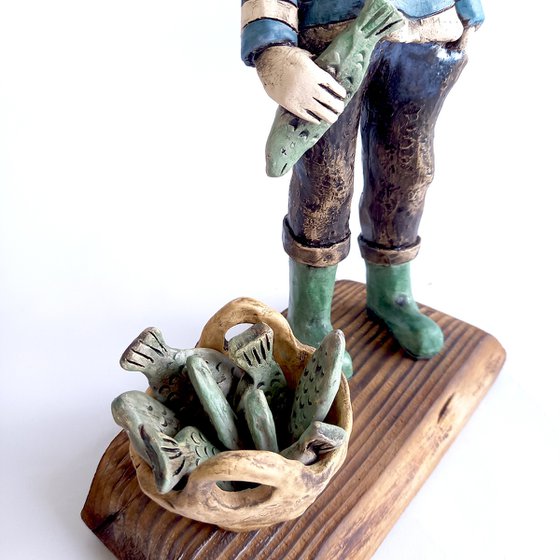 Good Cach (The Fisherman). Ceramic sculpture