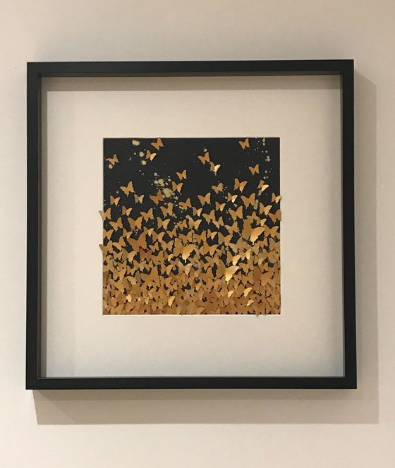 Butterfly swarm in gold