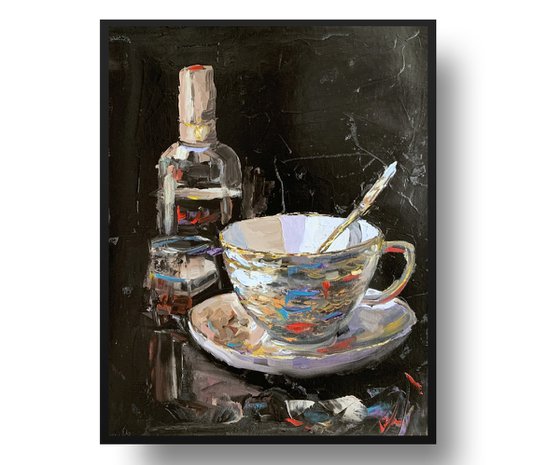 Tea cup and wine on black.