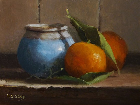 2 Clementines and a Blue Pot.