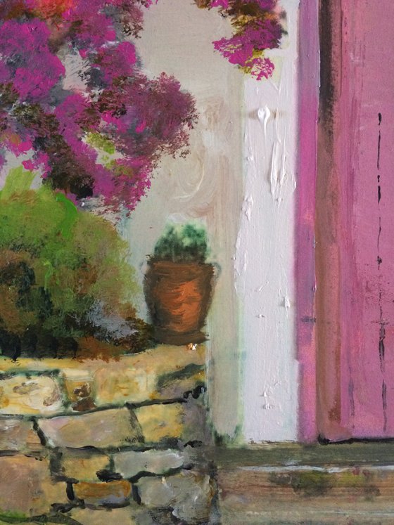 Mediterranean House with Pink Flowers