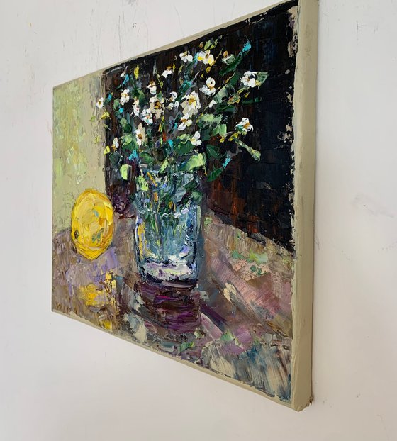 Still life with wildflowers and a lemon