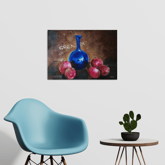 Still life with pomegranates and blue vase