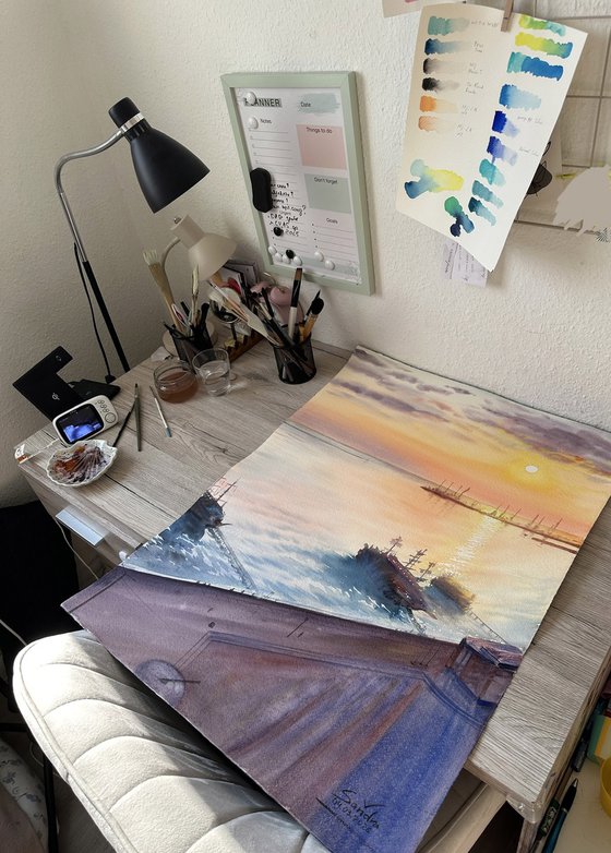 Serene Sunset over a Seaside Town